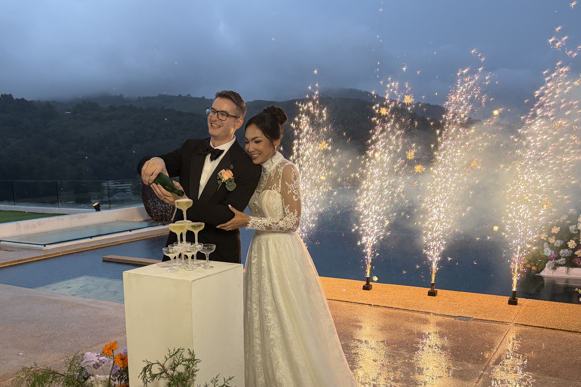 An evening wedding celebration beside the infinity pool at Villa Narissa, a seven bedroom luxury private villa in Kamala, Phuket, arranged and managed by Shibumi Services