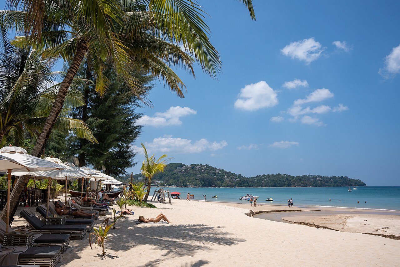 Bang Tao Beach, Phuket, looking north along the sand toward the headland