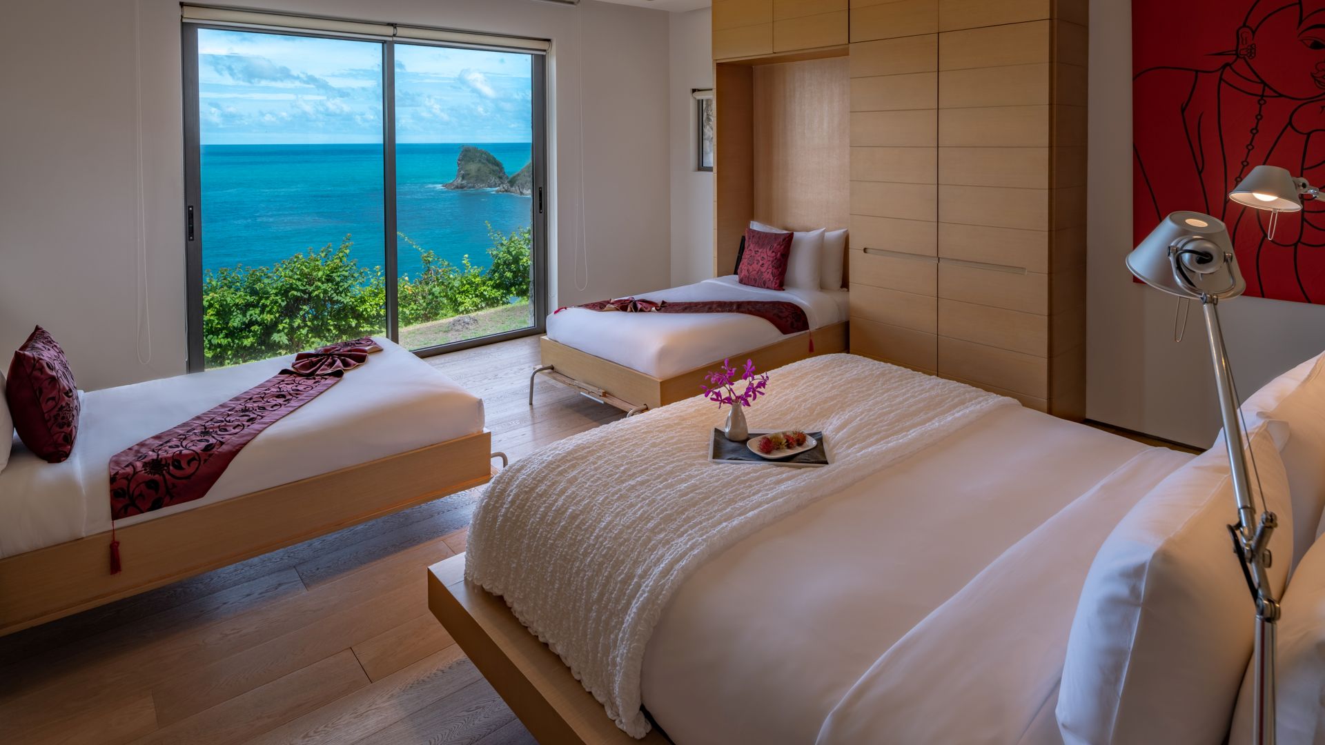 Bedroom with a sea view at a luxury villa in Phuket managed by Shibumi Services